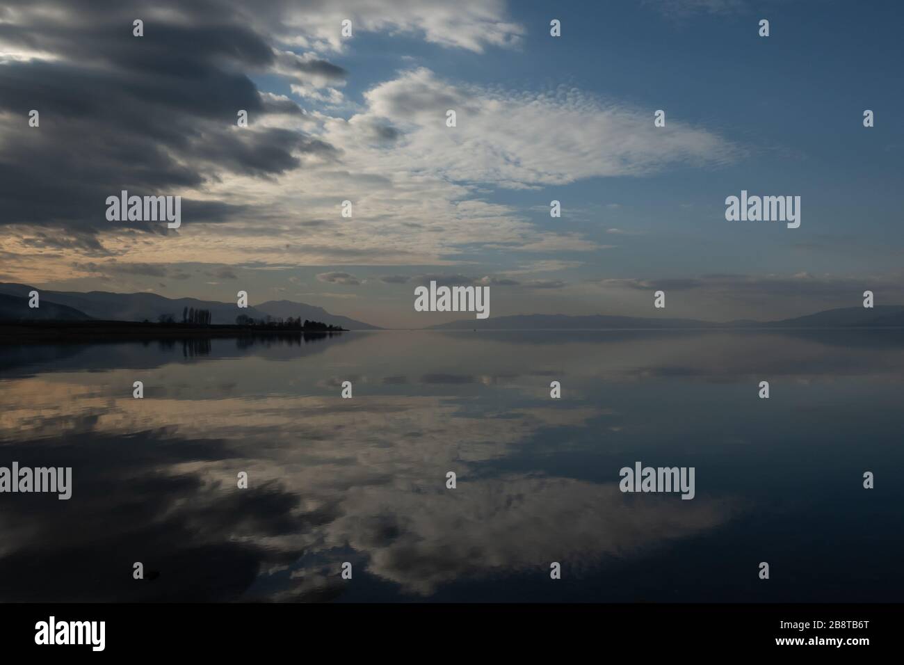 reflections in the still water of Lake Iznik at the end of day Stock Photo