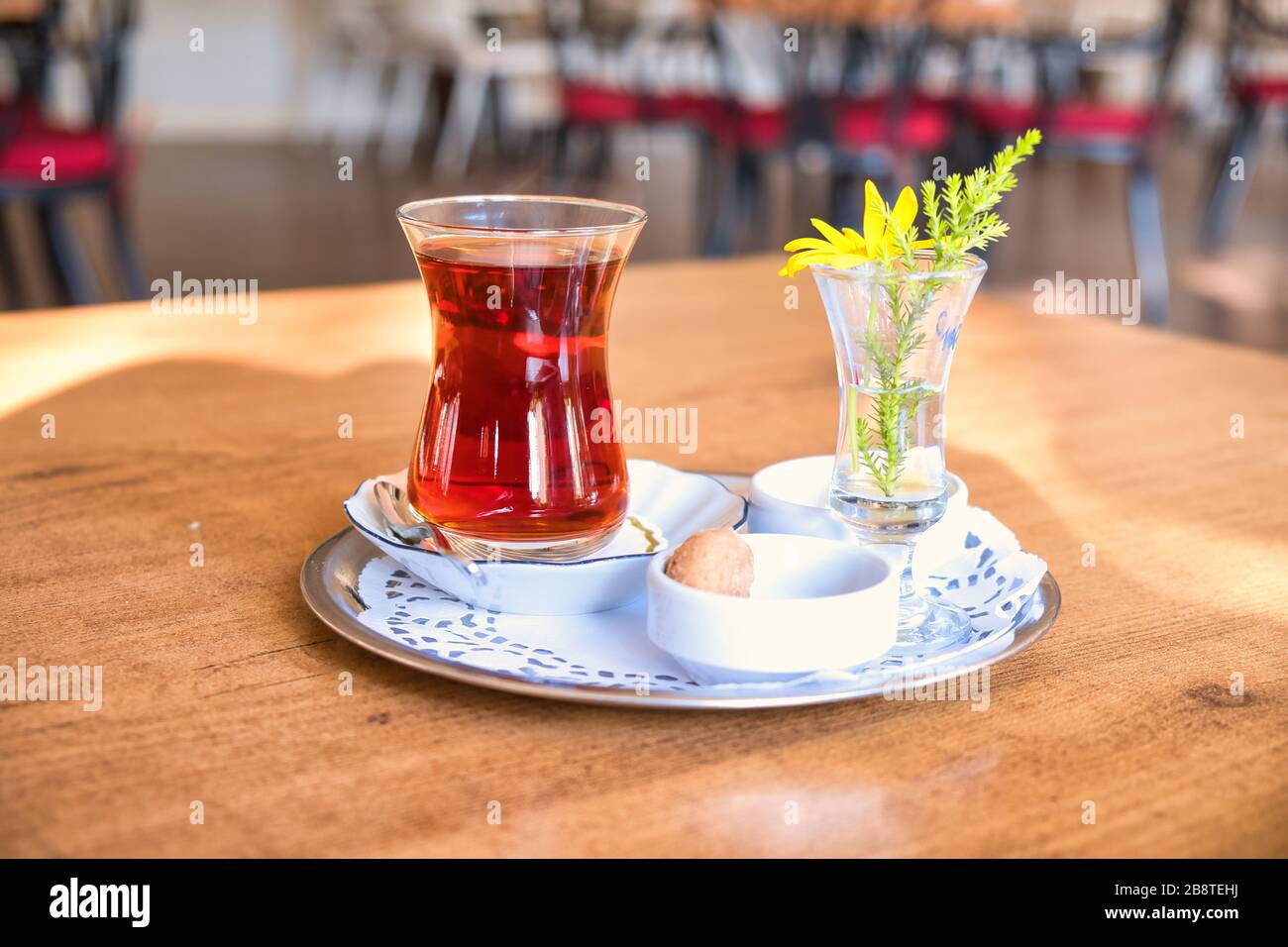 Winter tea brewed for five minutes. Glass Teapot Winter Tea on the wooden table. Stock Photo