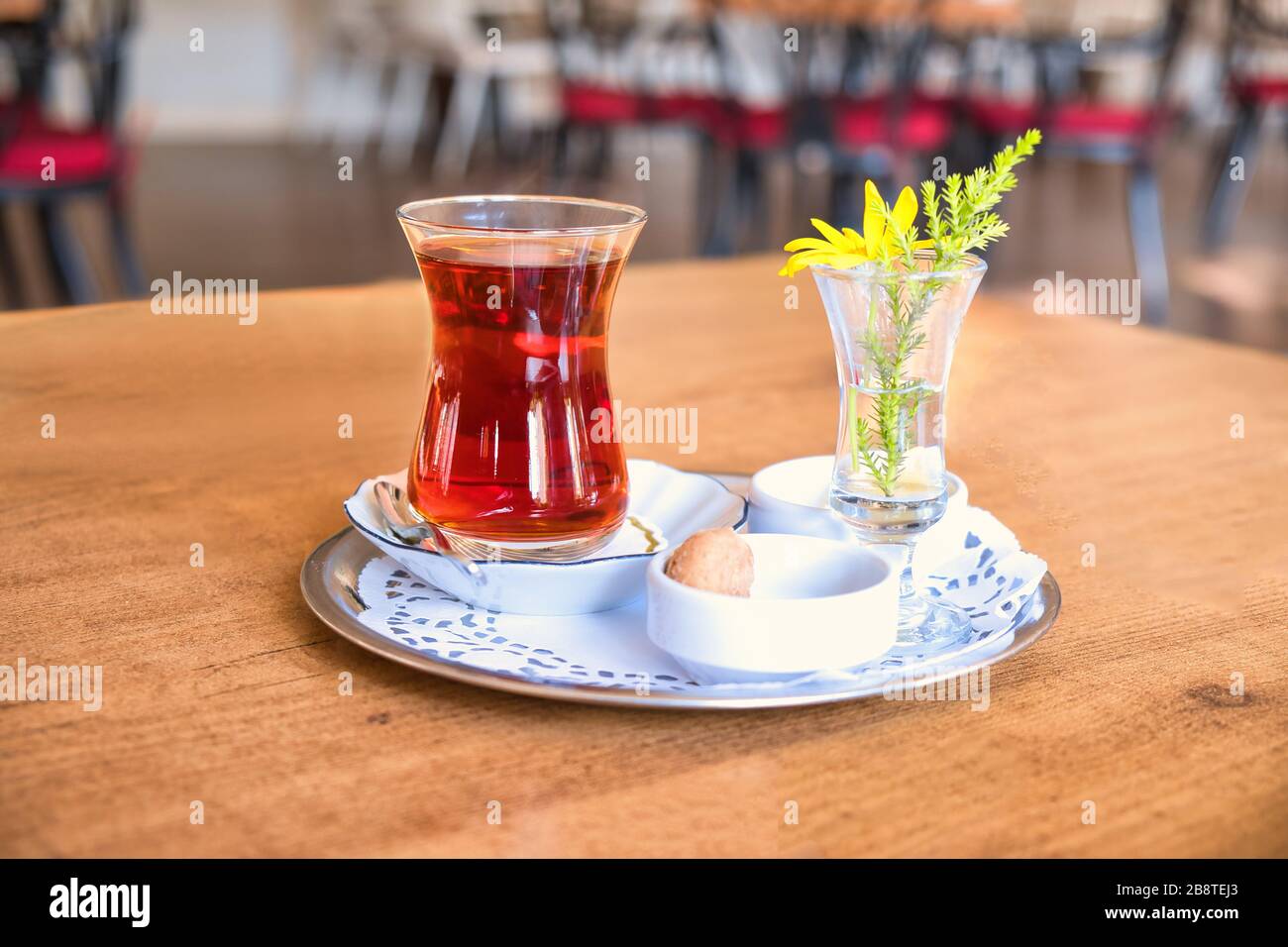 Winter tea brewed for five minutes. Glass Teapot Winter Tea on the wooden table. Stock Photo