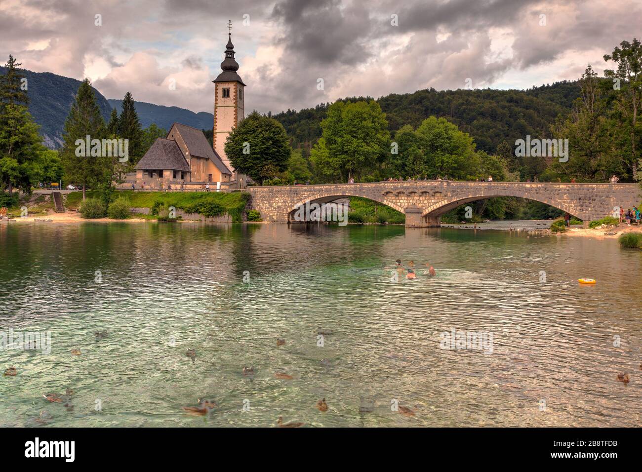 View of Bohinj lake with St John the Baptist church and bridge ...