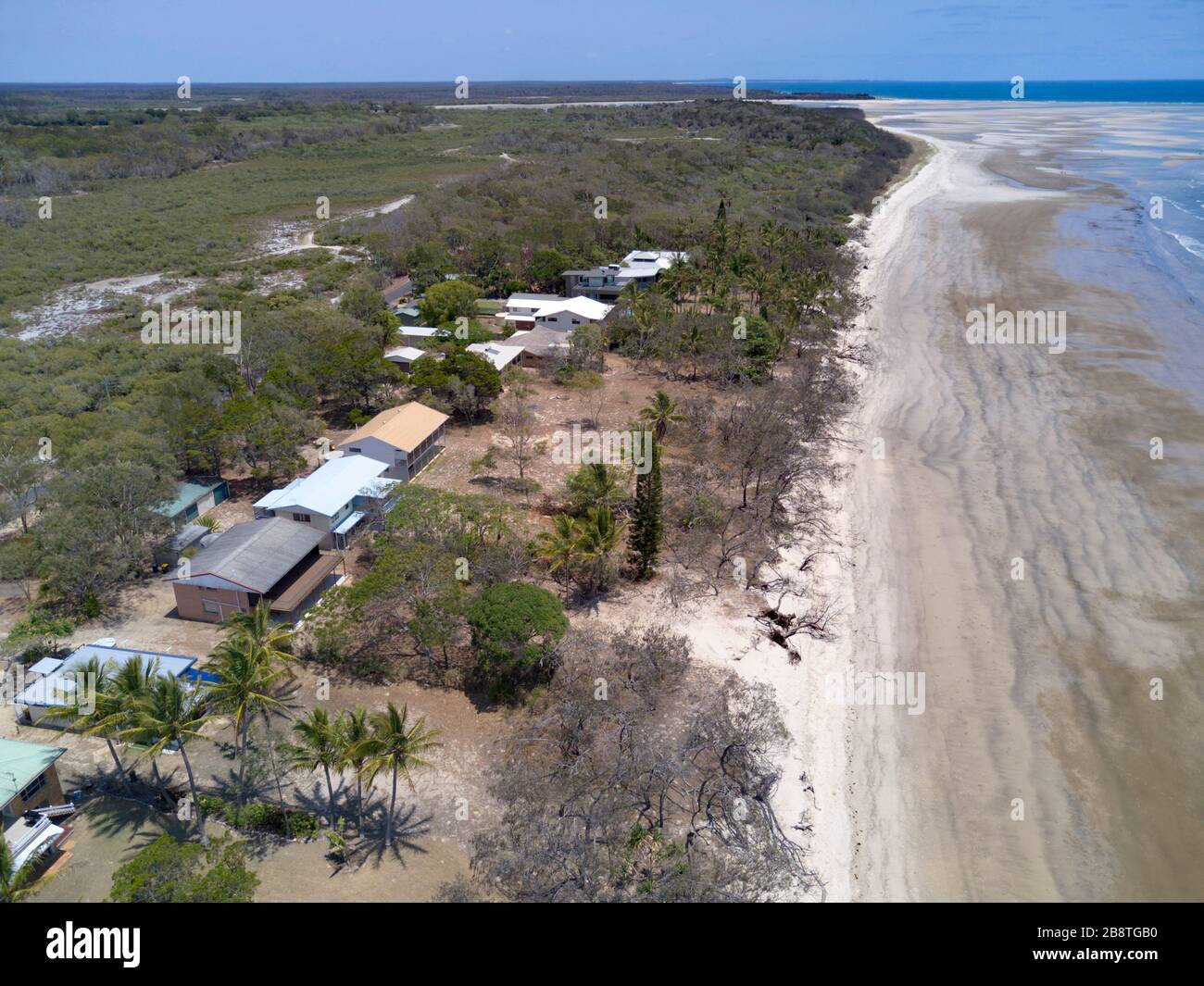 Aerial of holiday houses along the beach at Woodgate Beach Queensland