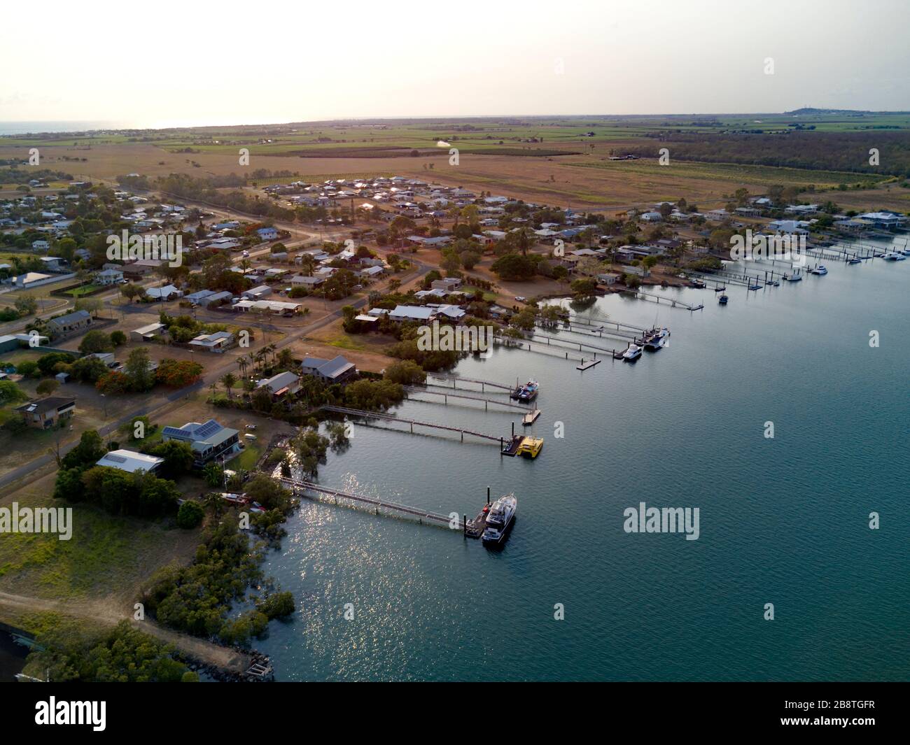 Aerial of waterfont houses complete with private boat jetties on the