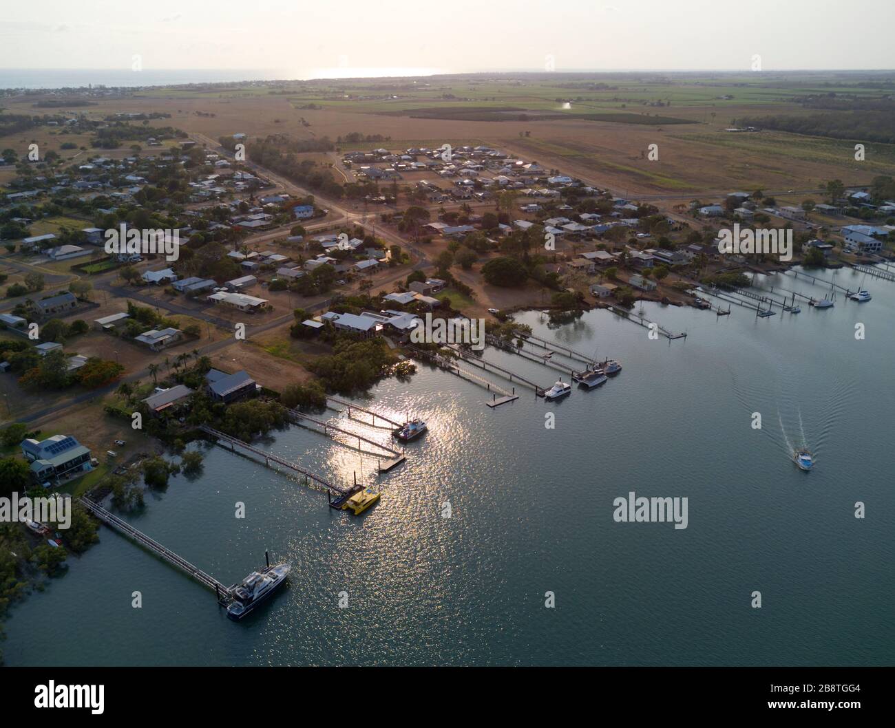 Aerial of waterfont houses complete with private boat jetties on the