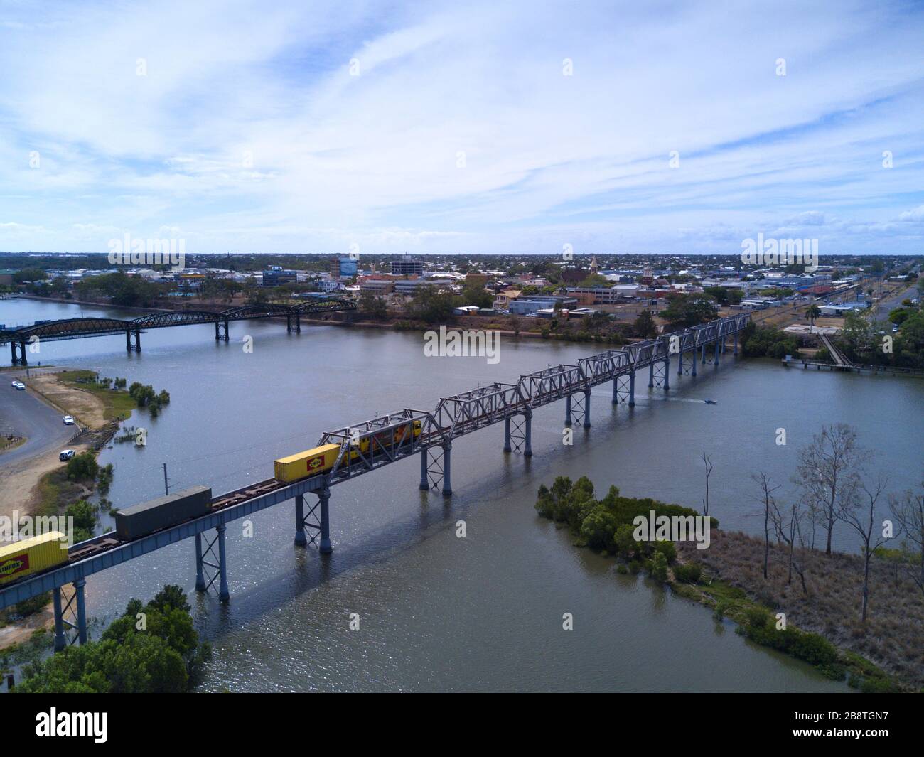 Aerial of freight train crossing the River at Bundaberg