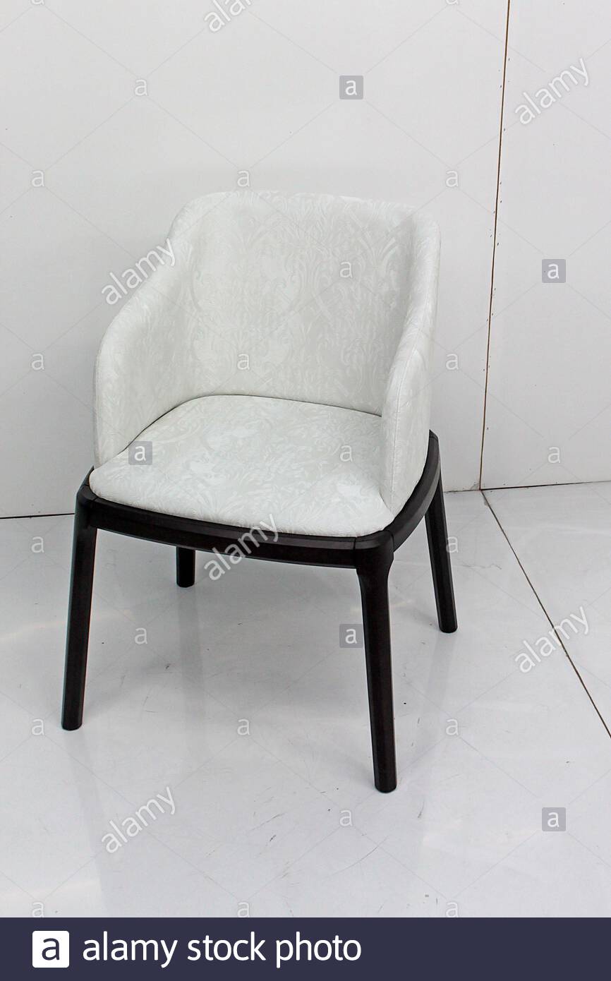 white upholstered armchair