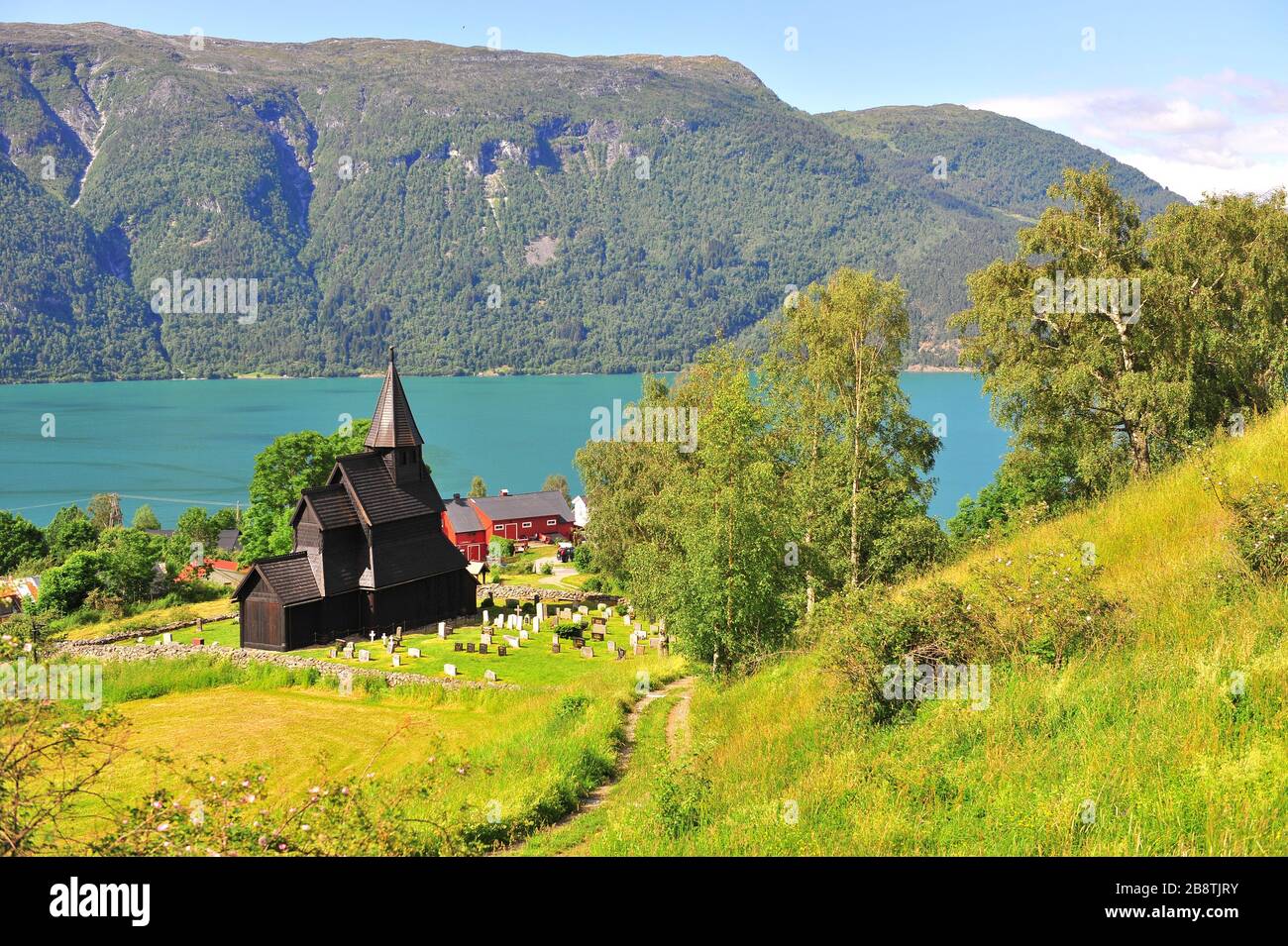 Classical view on Ornes stave church, the pearl of Norwegian fjords Stock Photo