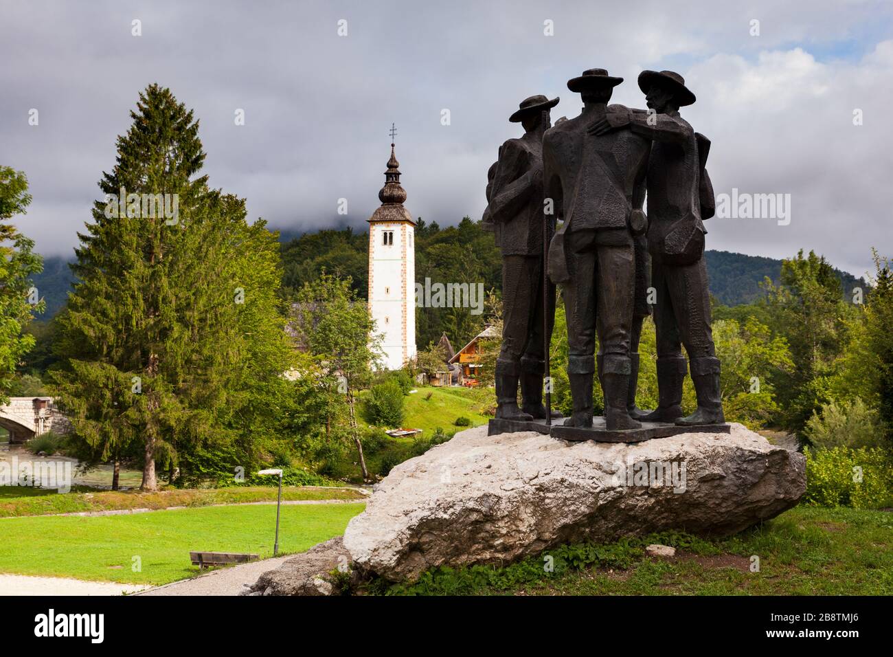 View of the Monument at Ribcev Laz commemorating four Courageous Men that climbed highest mountain Triglav in Slovenia in 1778 Stock Photo