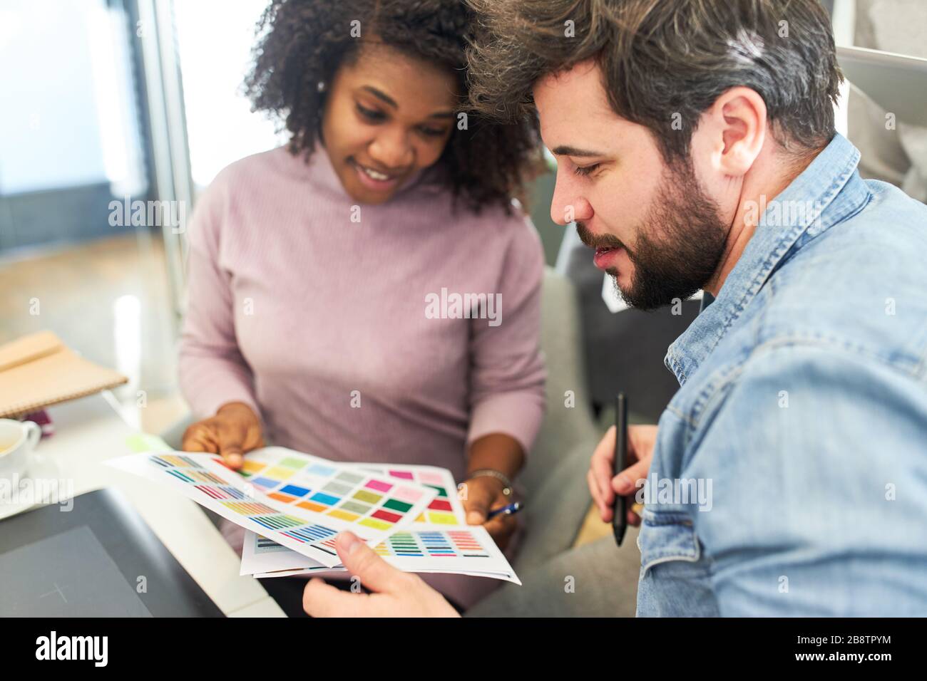 Graphic designer checking and selecting the color design for a website ...