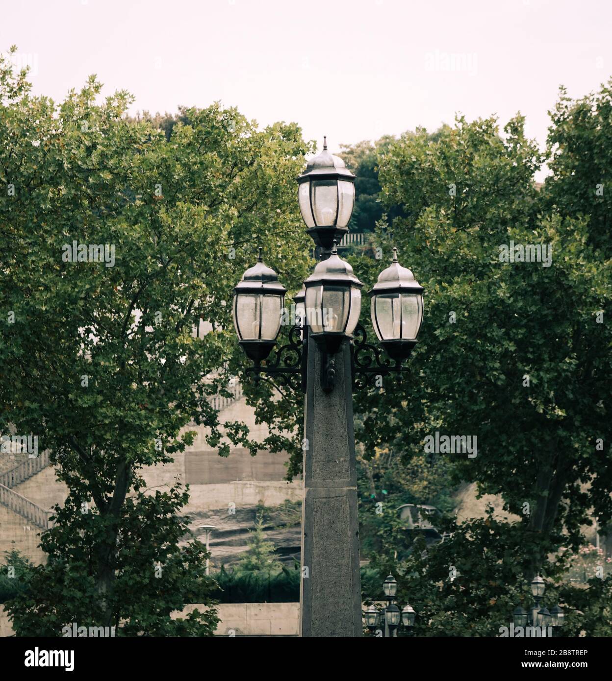 Old style lamp post at the park in Tbilisi, Georgia. Stock Photo