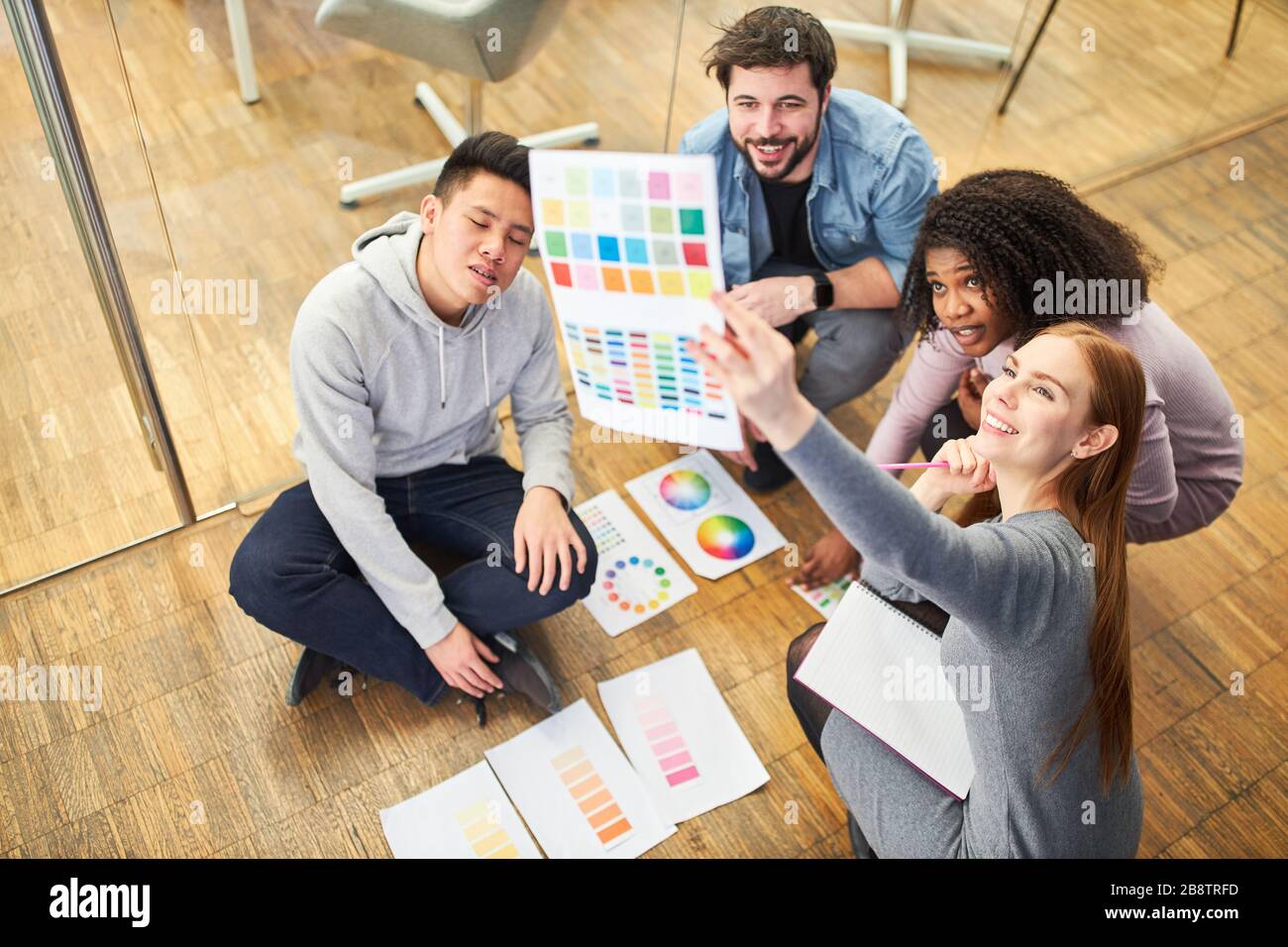 Graphic designer team in internet agency at brainstorming for the color design of a website Stock Photo