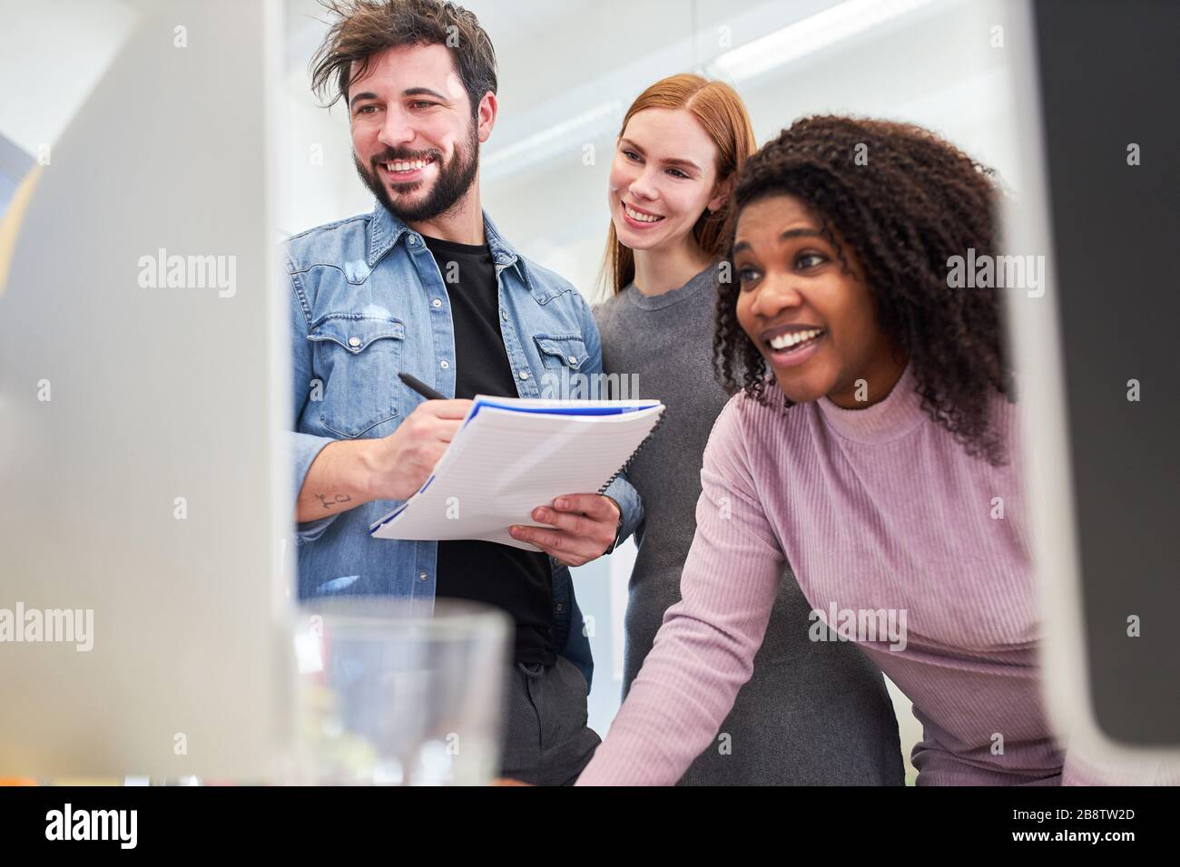 Web designer as a creative start-up team works together on a PC on a project Stock Photo