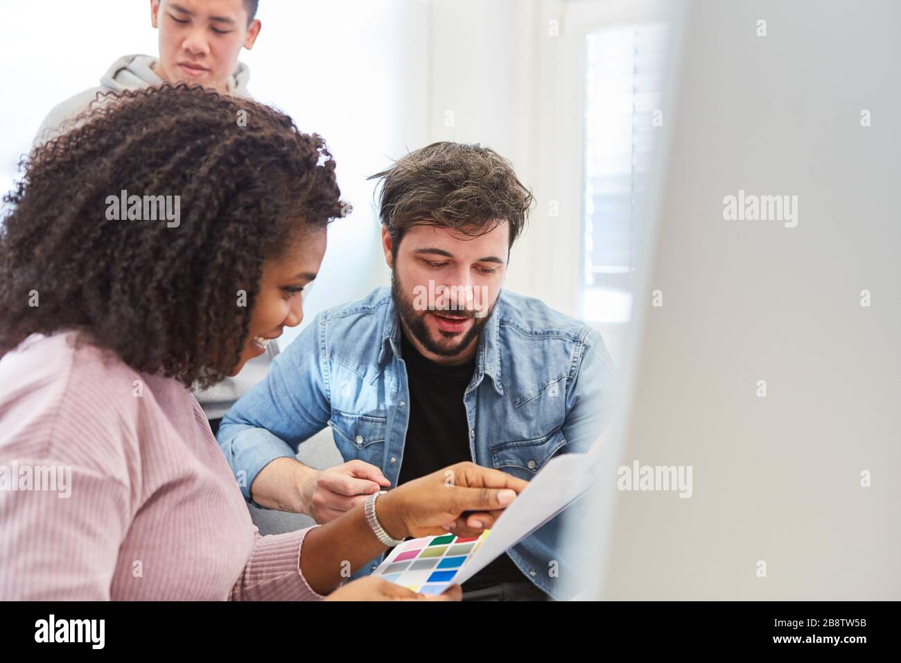 Graphic designer and web developer on the PC during the color design for a design project Stock Photo