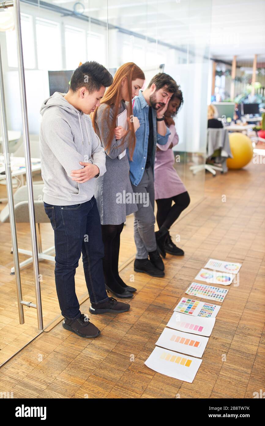 Graphic designer start-up team brainstorming the color design of a website Stock Photo