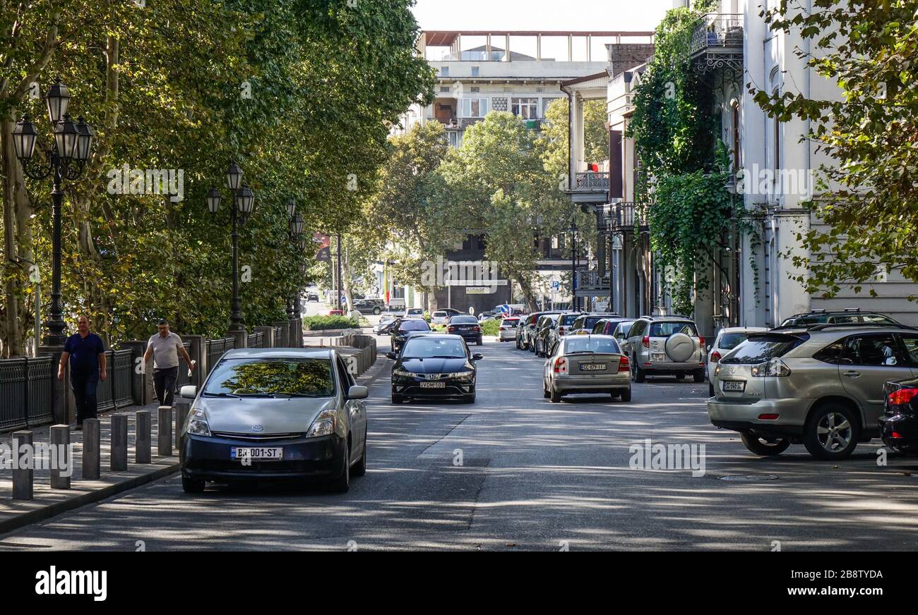 Tbilisi, Sep 22, 2018. Cars on street with many trees in Tbilisi, Tbilisi is
