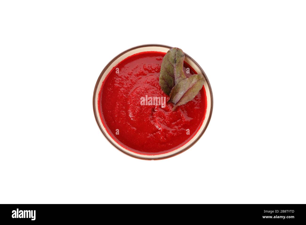 Tomato cream soup isolated on white background Stock Photo - Alamy