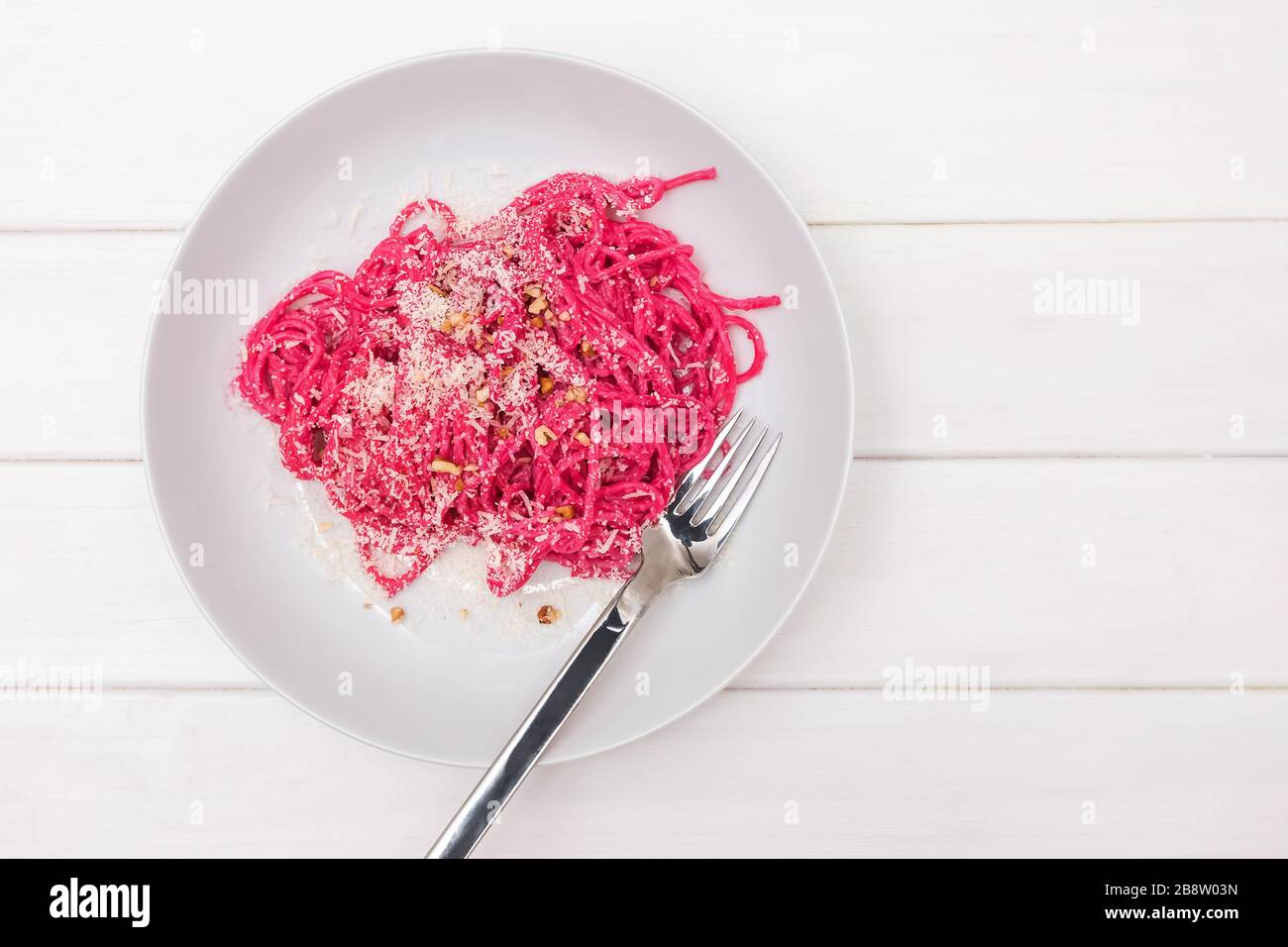 Spaghetti pasta with pink beetroot sause. Delicious lunch Stock Photo