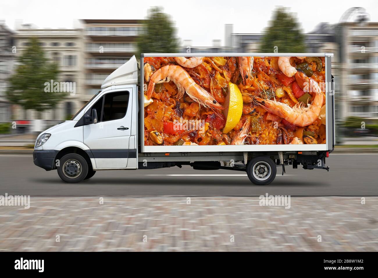 Spanish delivery truck in motion on city street road Stock Photo Alamy
