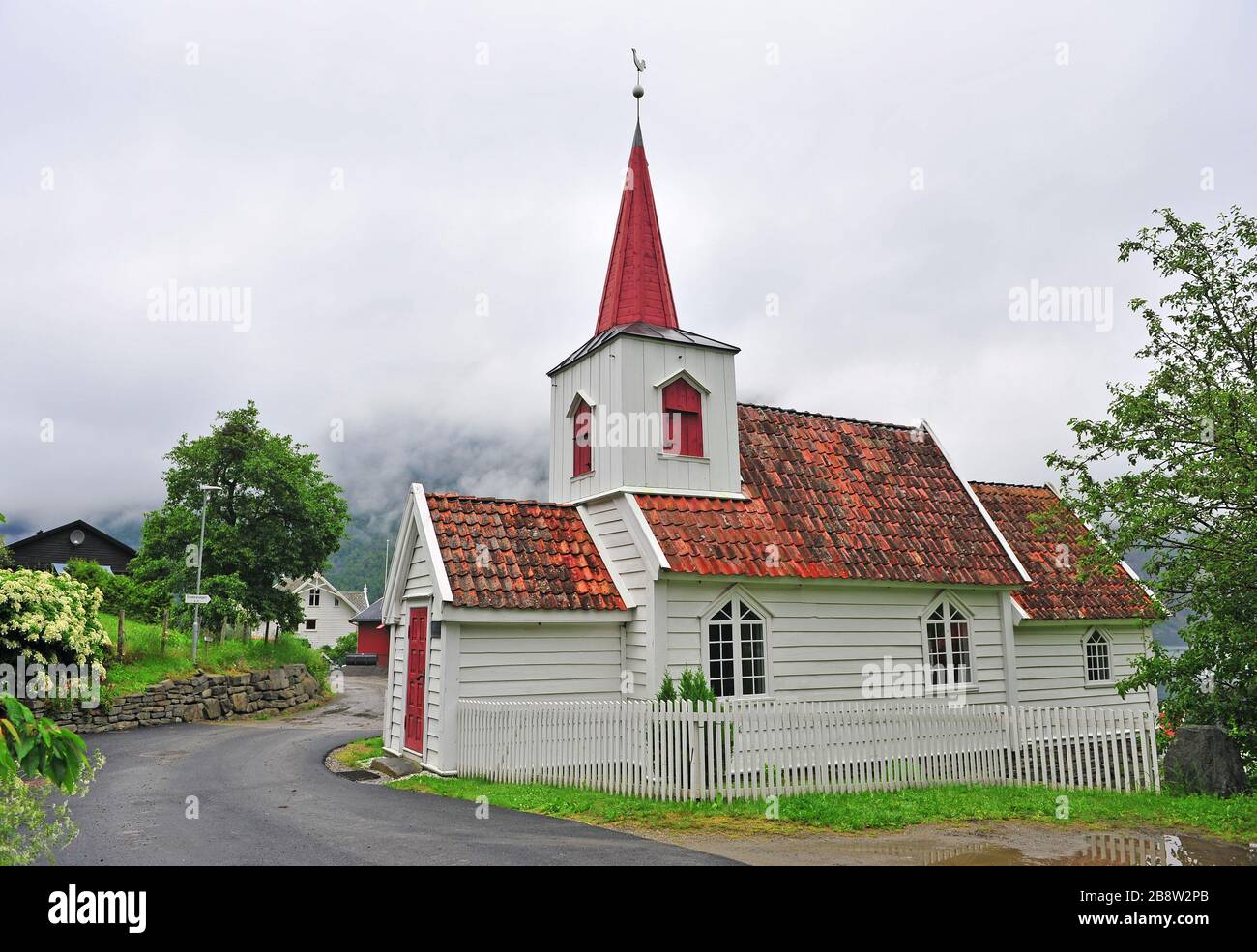 Traditional white wooden church in Undredal village, Norway Stock Photo