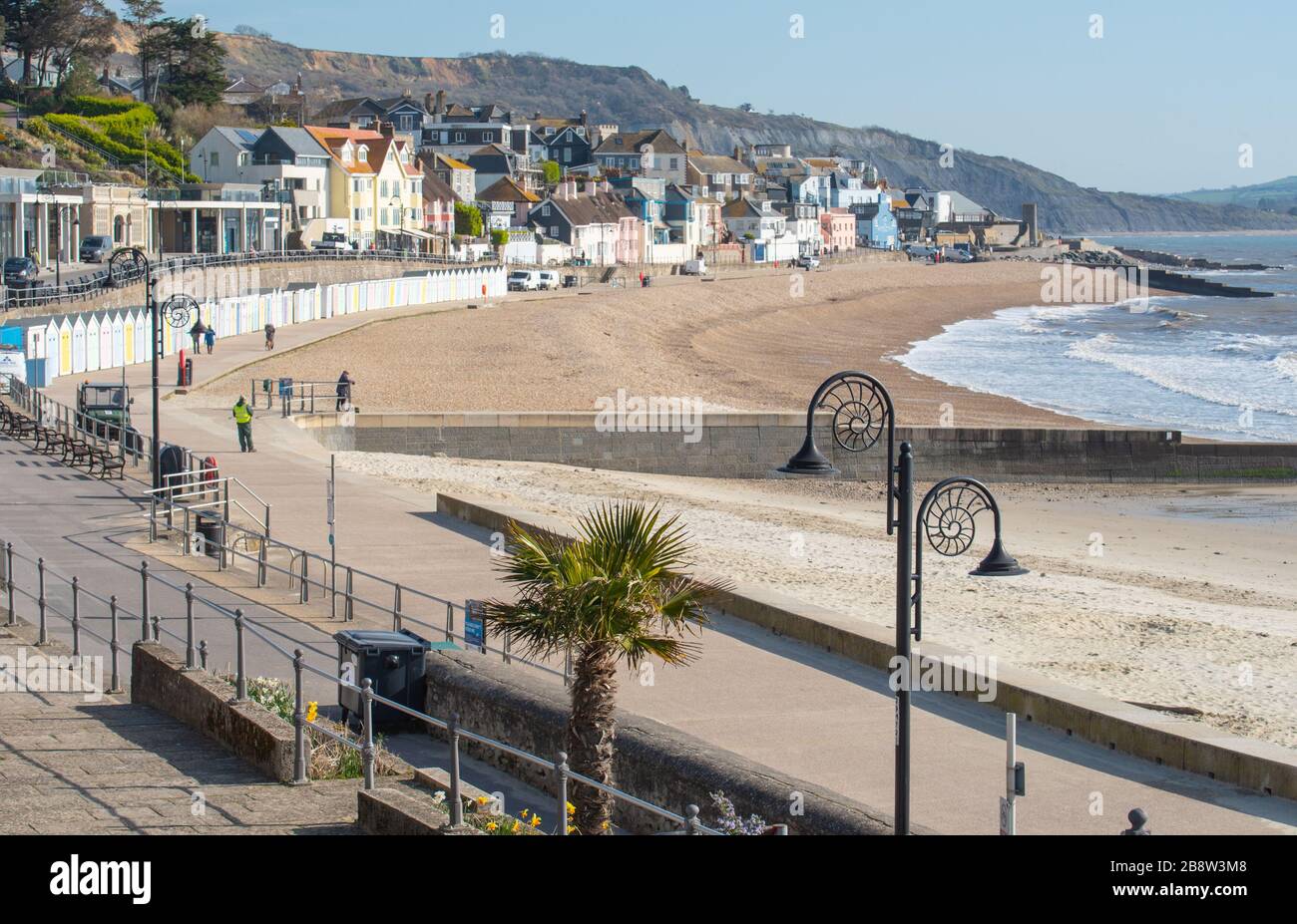 Lyme Regis, Dorset, UK. 23rd Mar, 2020. UK Weather: Lyme Regis' beaches were almost empty as people appear to be following Government advice to engage in social distancing and/or stay away from busy areas amid the coronavirus outbreak. Credit: Celia McMahon/Alamy Live News Stock Photo