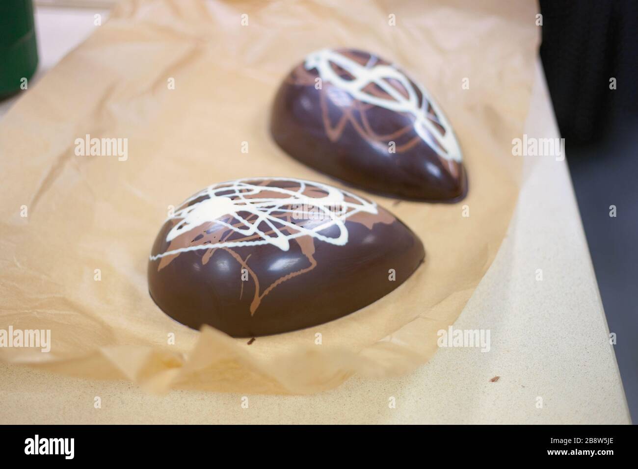 Making chocolate. Making chocolate easter eggs. Chocolate factory Stock