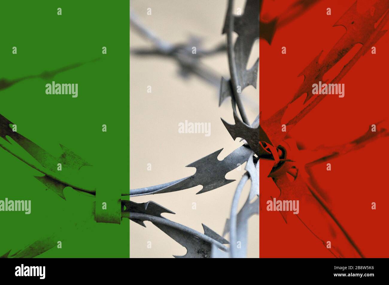 The Italian flag is bound with barbed wire. Country isolation concept. Stock Photo