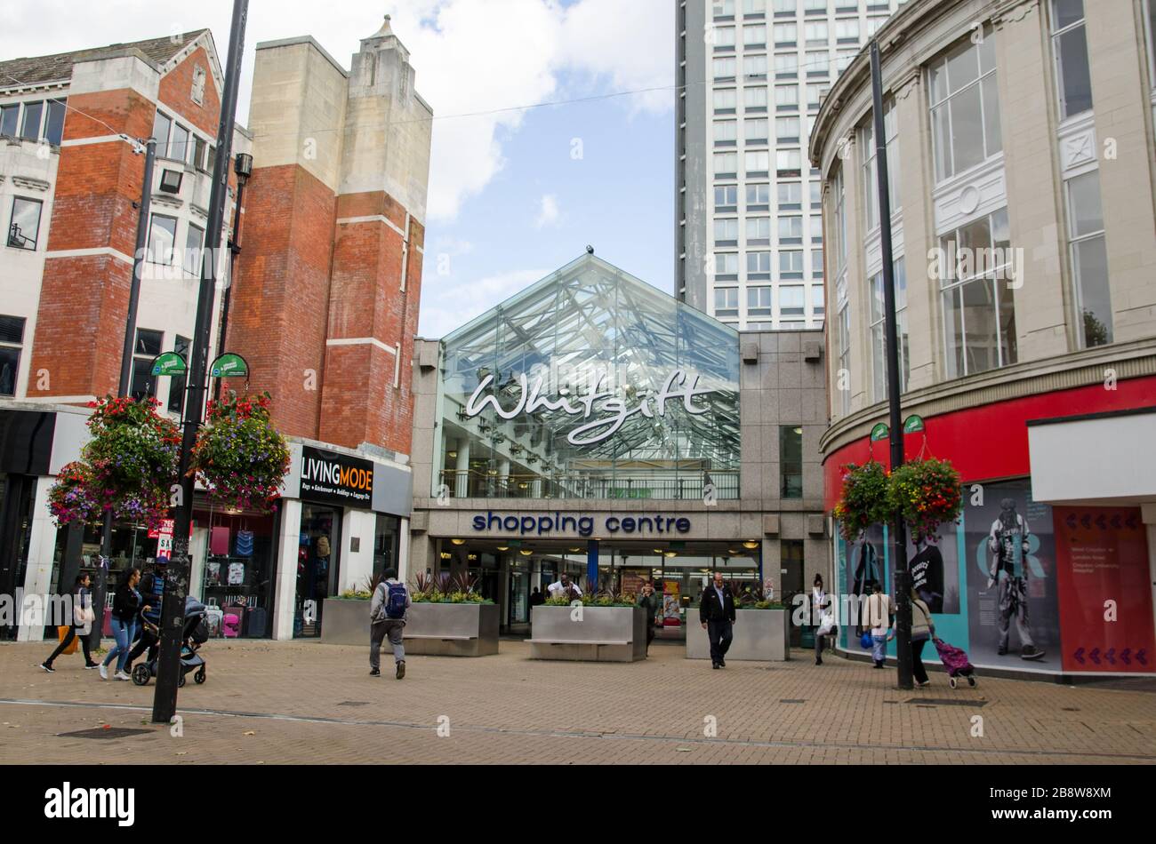 Croydon, UK - October 2, 2019: Shoppers at the entrance to the landmark Whitgift Shopping Centre in Croydon, South London on a sunny autumn afternoon. Stock Photo