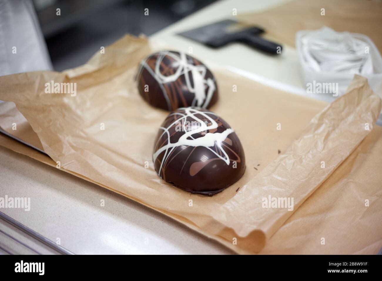 Making chocolate. Making chocolate easter eggs. Chocolate factory Stock