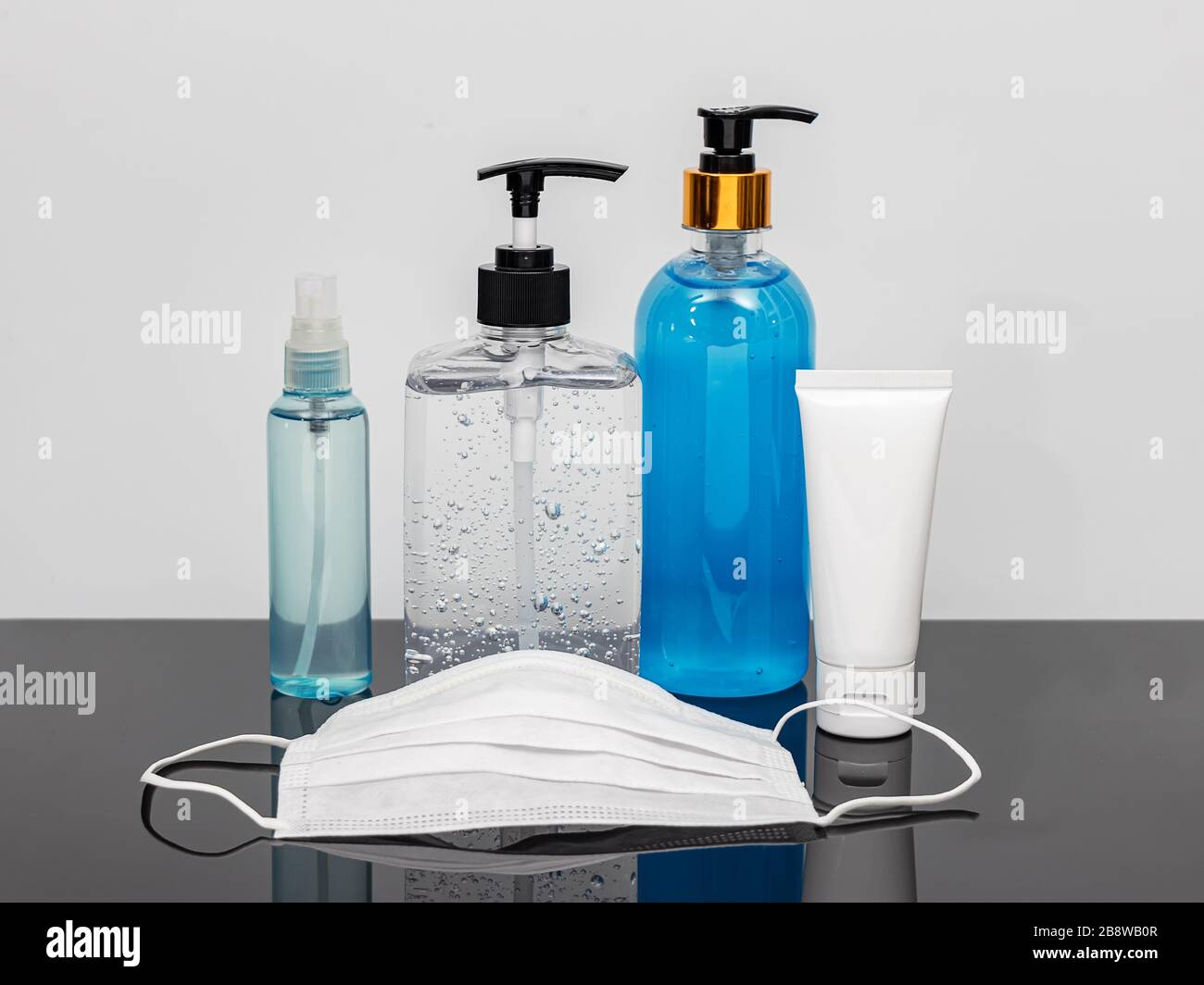 cleaning product such as hand sanitizer alcohol gel , portable alcohol spray , alcohol gel in a pump bottle , hygienic mask for disinfection, prevent Stock Photo