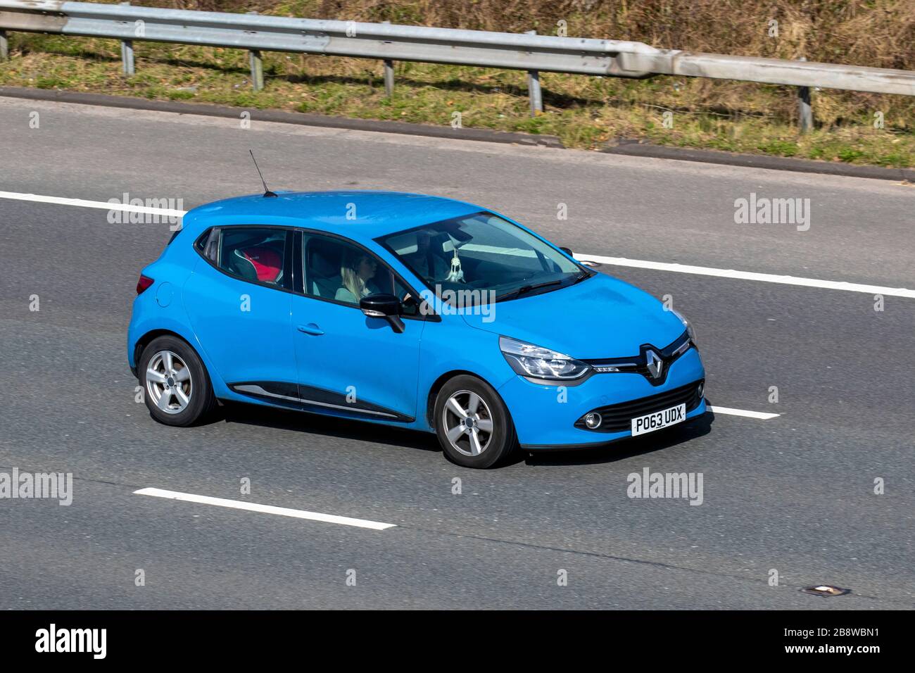 2013 Renault Clio D-QUE M-Nav NRG TCE; UK vehicular traffic, transport, moving vehicles, vehicle, roads, motors, motoring  on the M6 motorway highway Stock Photo