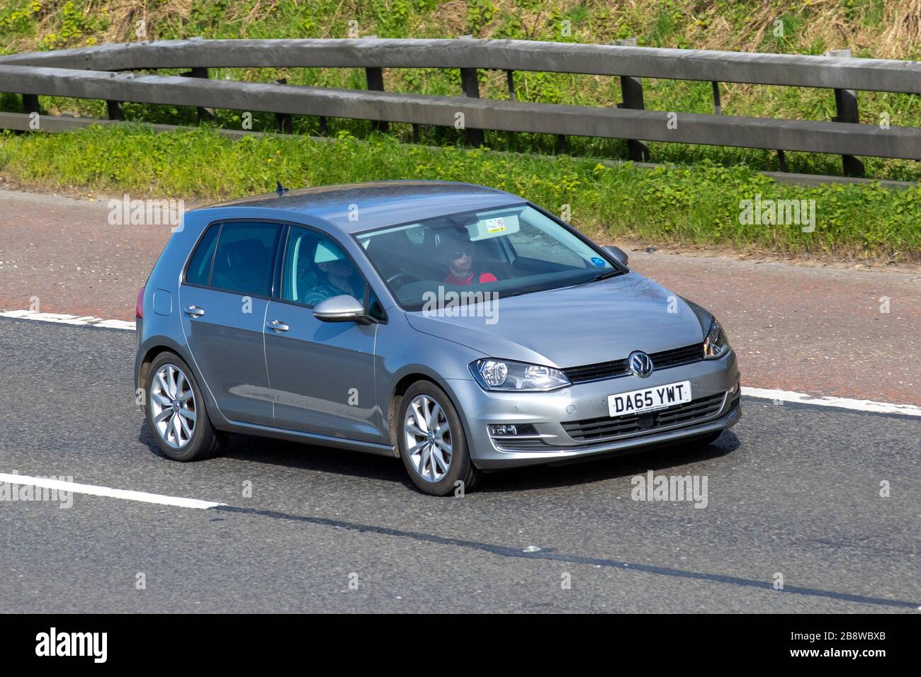 2015 silver Volkswagen Golf GT TSI ACT BMT; UK vehicular traffic, transport, moving vehicles, vehicle, roads, motors, motoring  on the M6 motorway highway Stock Photo