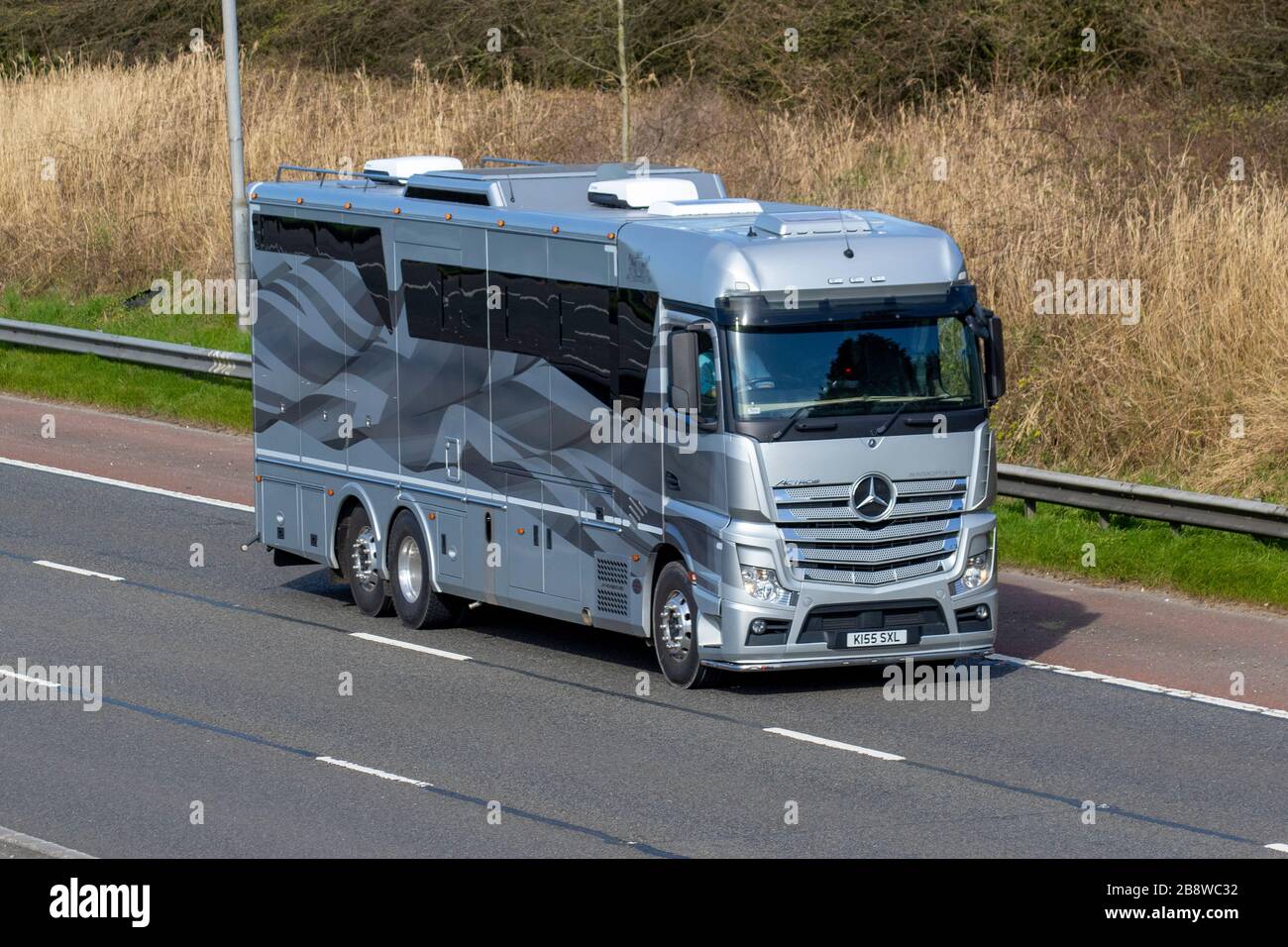 Mercedes Benz Actros Jm Interceptor SXL Touring Caravans and Motorhomes, campervans, RV leisure vehicle, family holidays, vacations, caravan holiday, life on the road M6 motorway, Manchester, UK Stock Photo