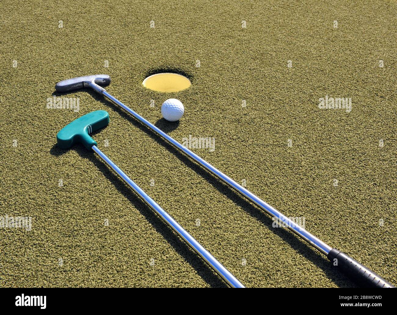 Mini golf equipment in the green grass court Stock Photo Alamy