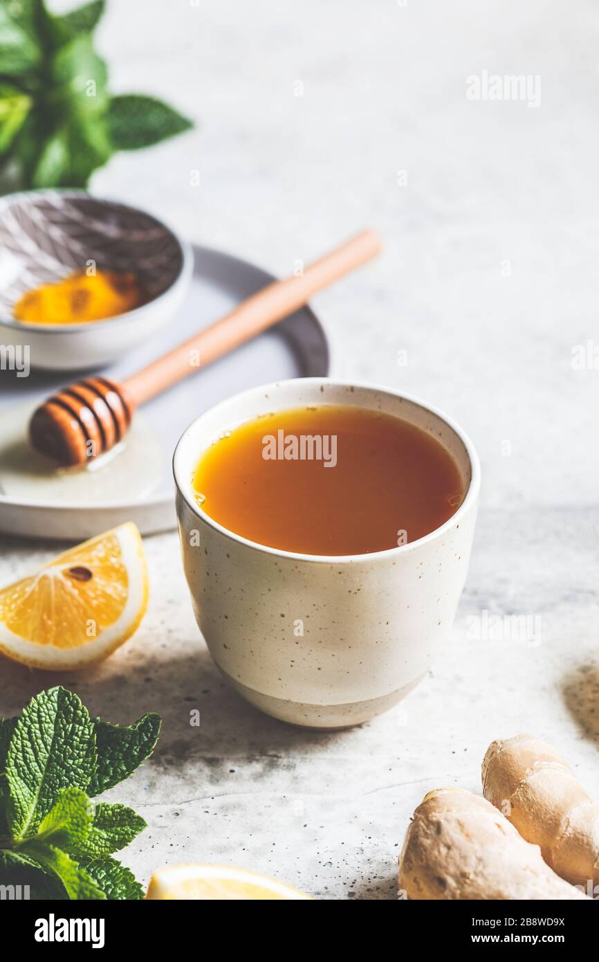 Beverage for raising immunity concept. Warm drink with turmeric, honey and lemon. Stock Photo