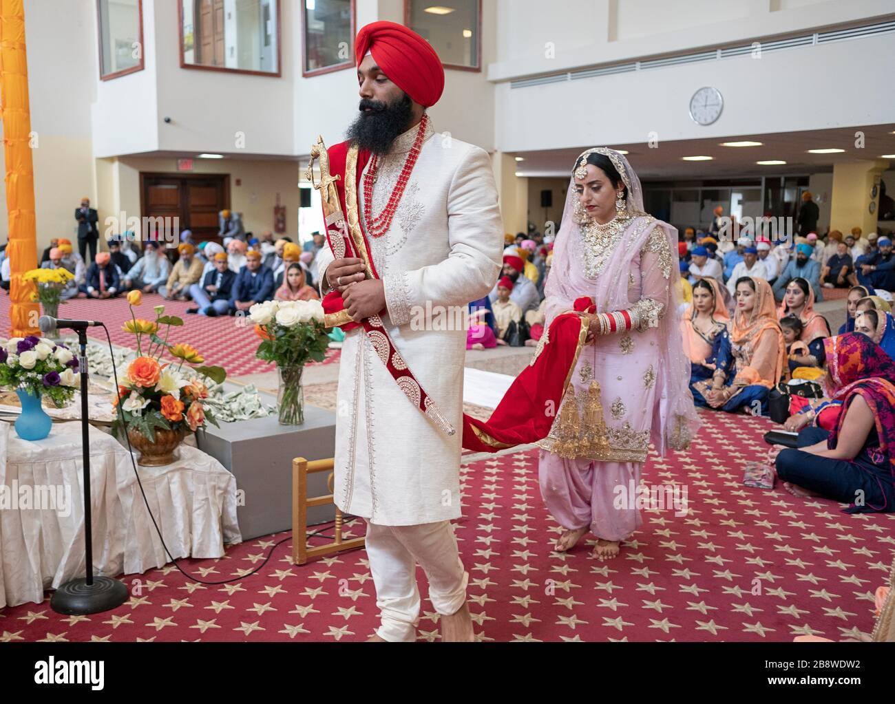 A Sikh bride and groom at their wedding ceremony in a temple in South Richmond Hill, Queens, New York City. Stock Photo