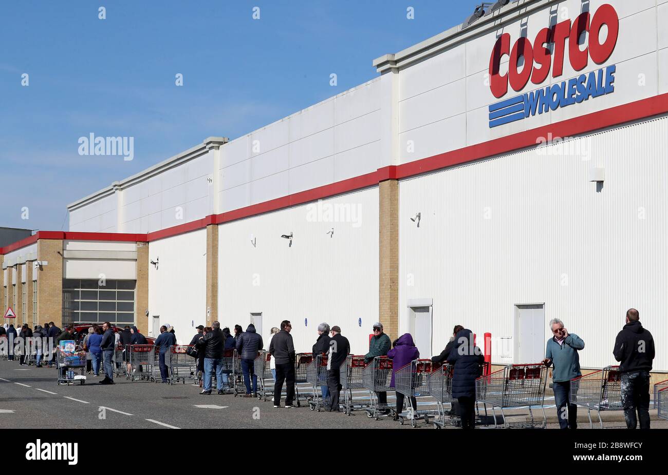 Photograph of people queuing outside of Costco in West Thurrock