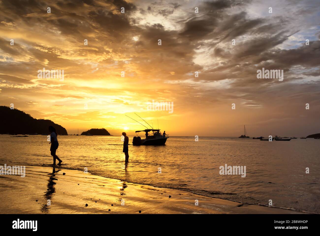 Dreamy sunset over a beach in Costa Rica. Beautiful pacific ocean landscape. Stock Photo