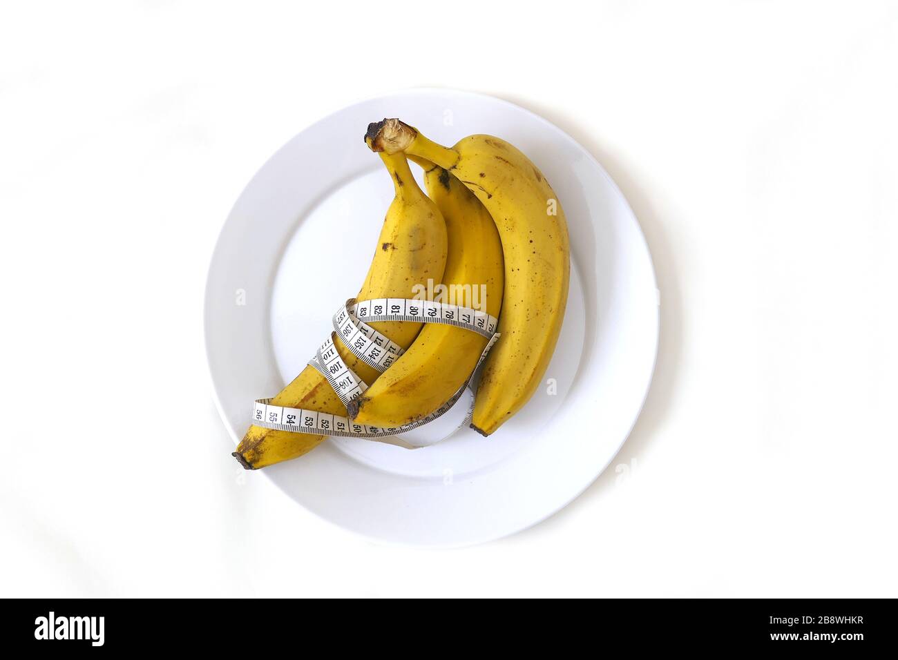Banana and healthy weight loss, banana and diet, with tape measure on