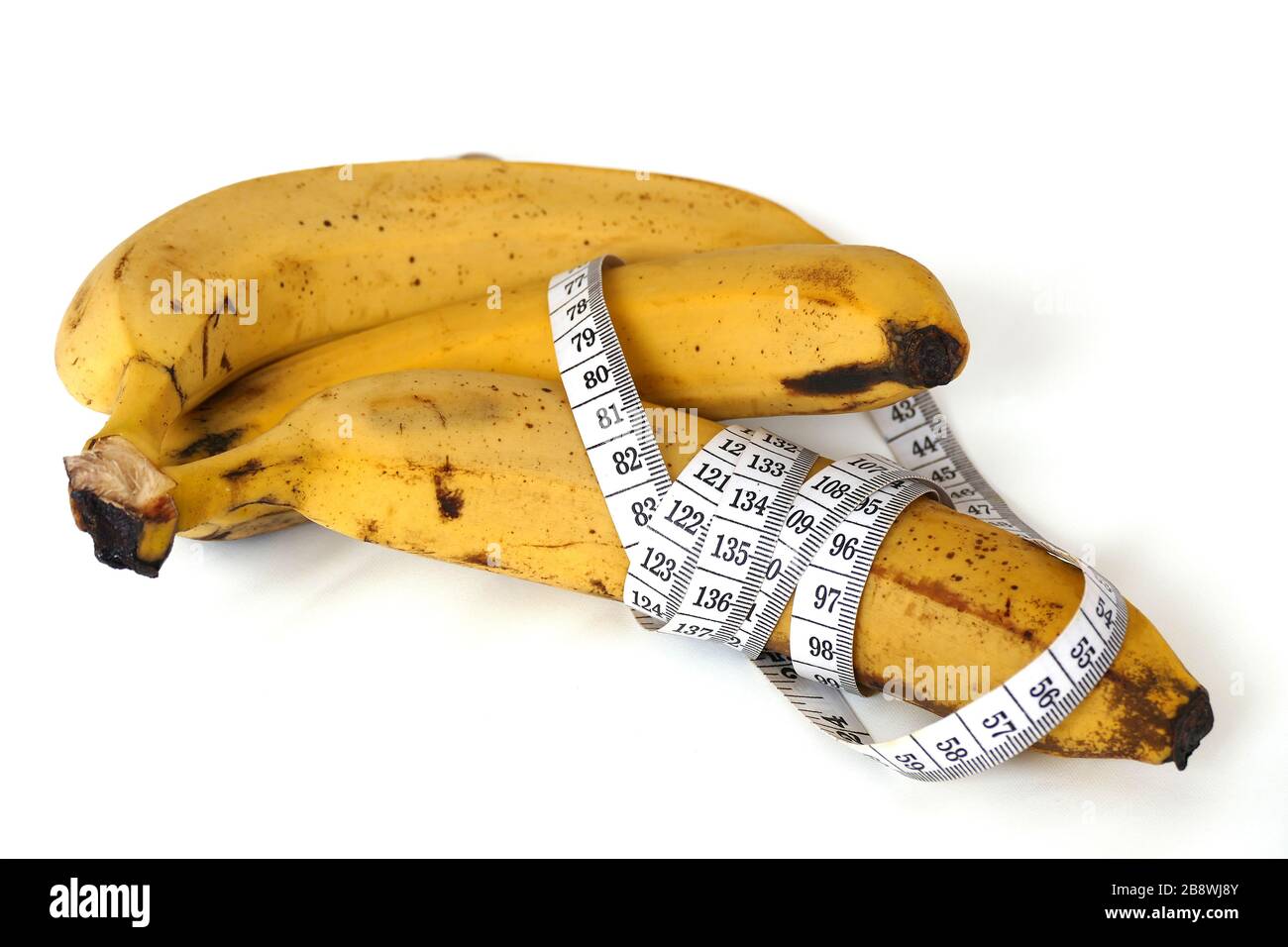 Banana and healthy weight loss, banana and diet, with tape measure on