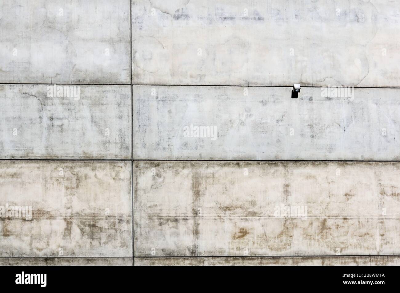 modern industrial concrete wall with a spotlight for led lighting Stock
