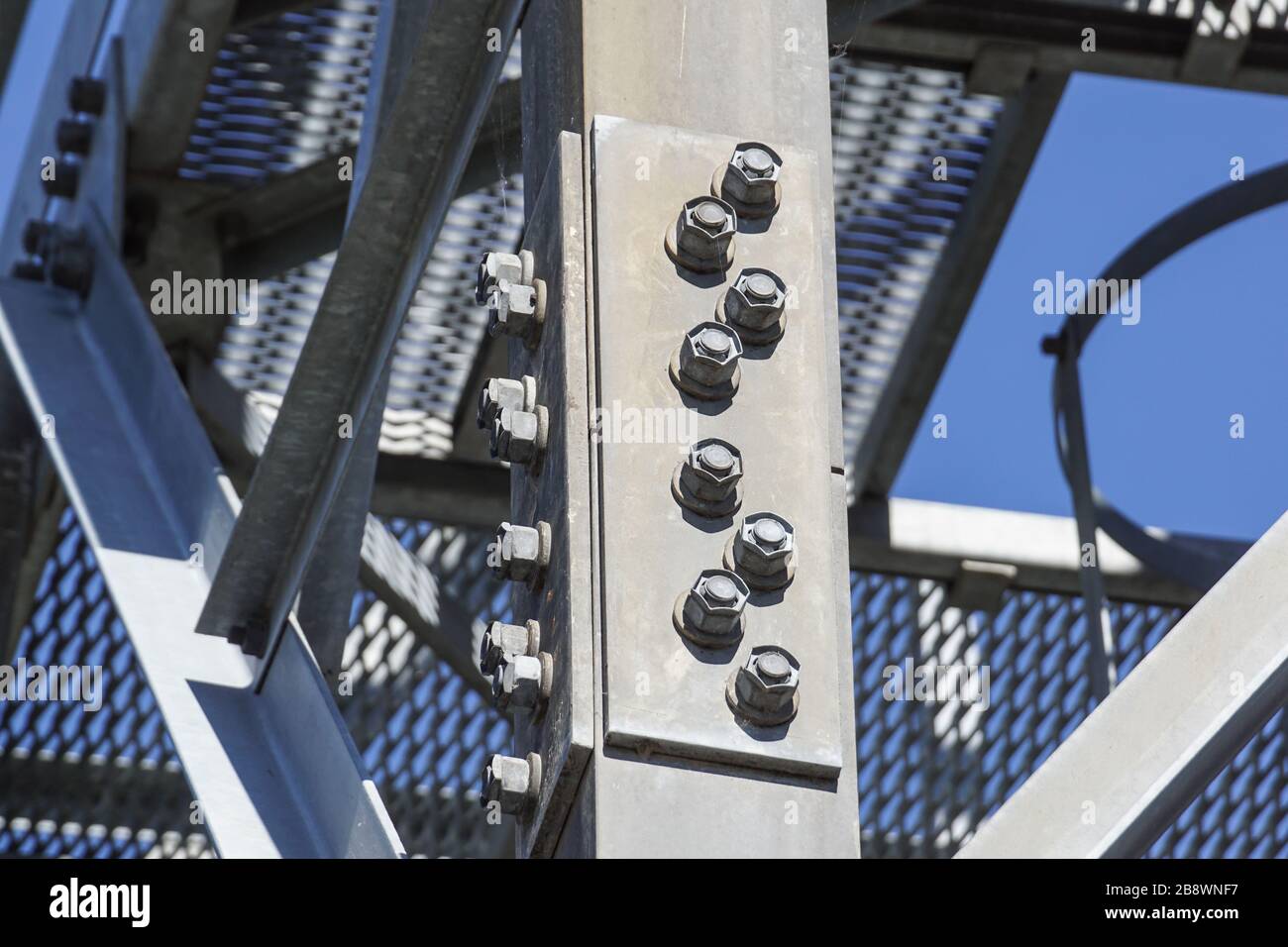 Joint of steel structure with bolt and nut at construction site Stock