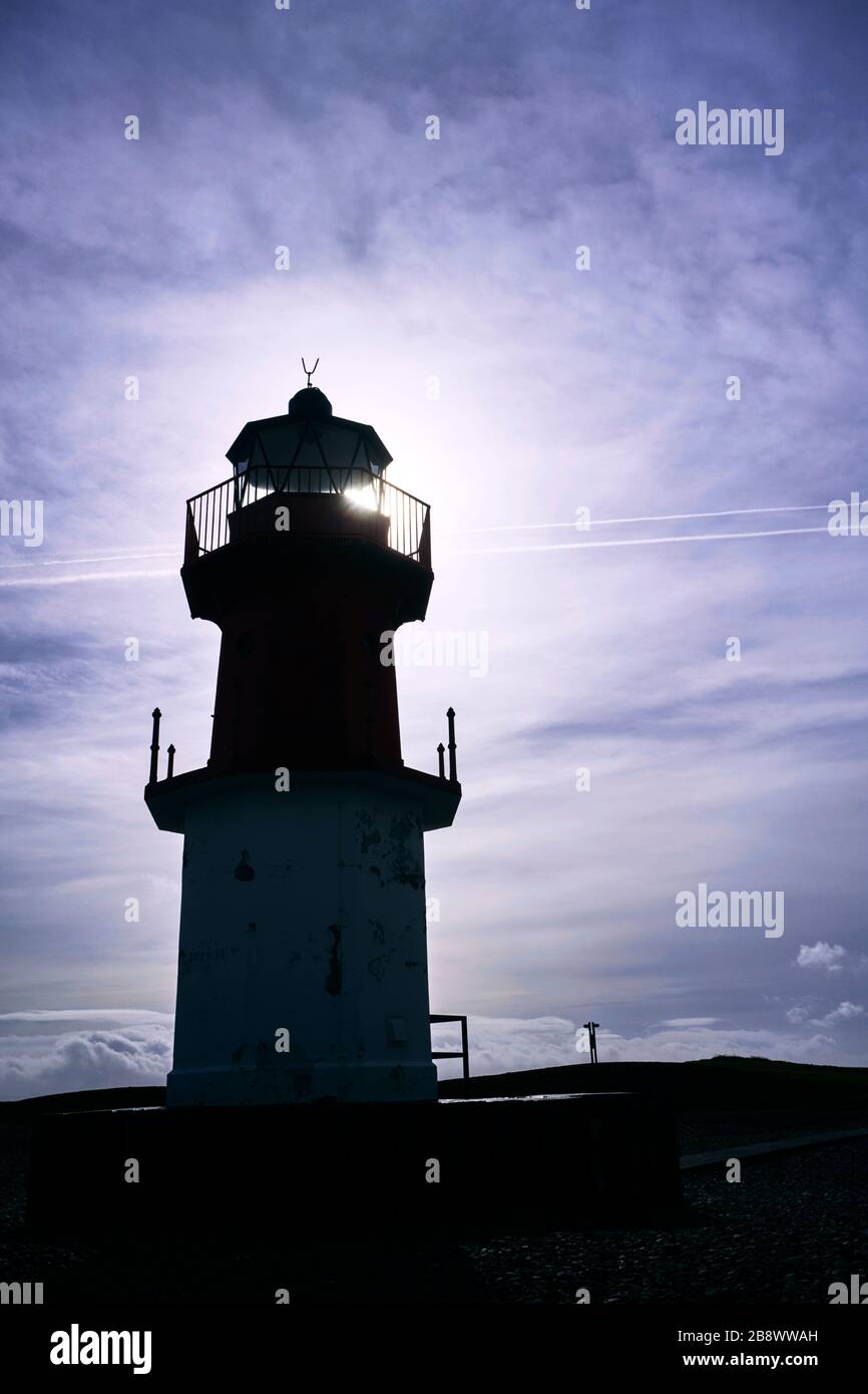 Sundown against the Winkie lighthouse at Point of Ayre in the Isle of Man Stock Photo