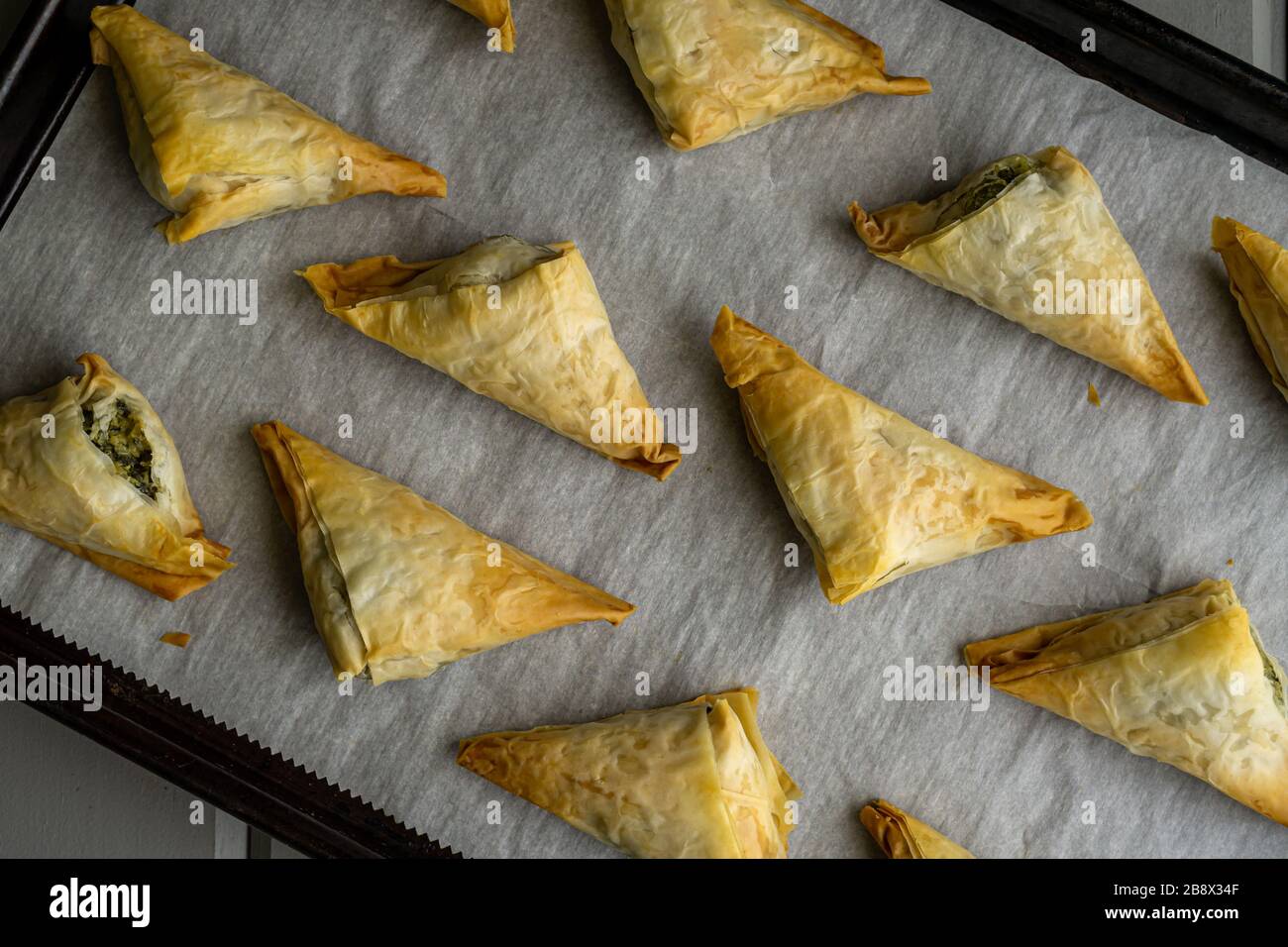 Baked Spanakopita triangles Stock Photo Alamy