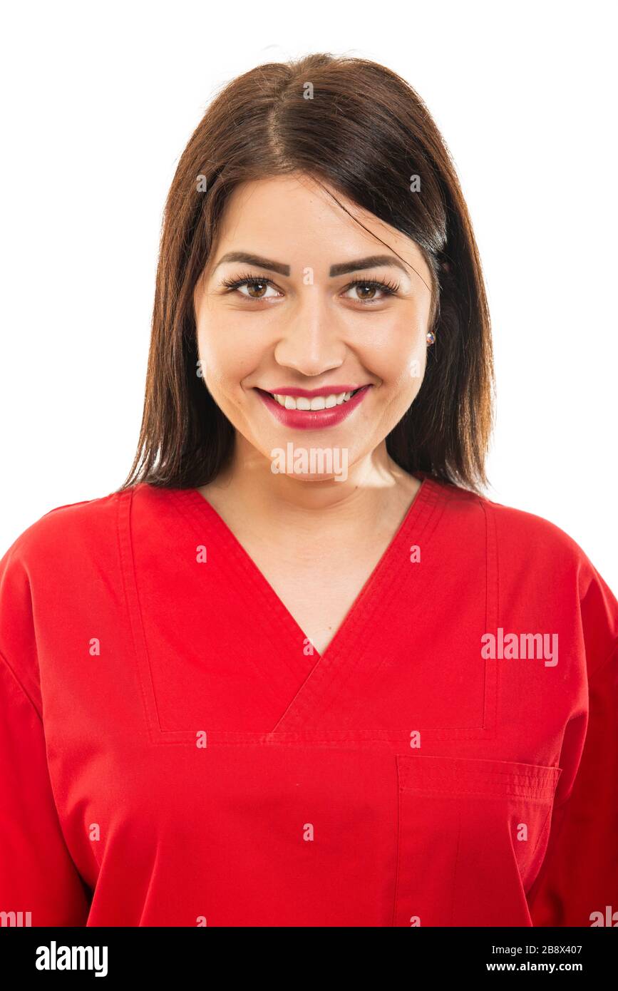 Portrait of beautiful young doctor wearing scrubs and smiling gesture