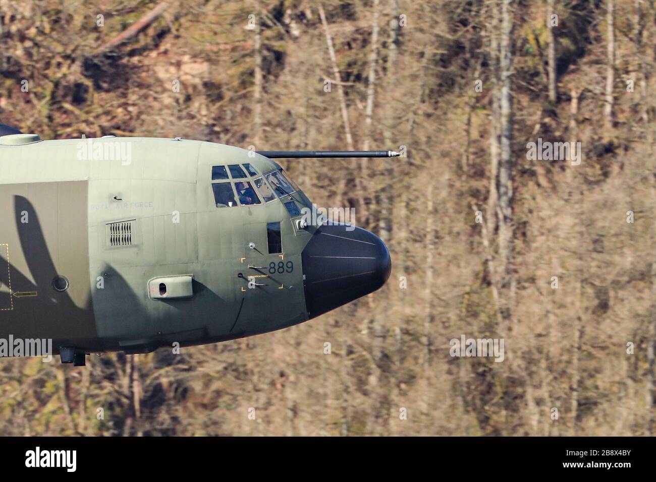 19th March 2020, Thirlmere, Allerdale, Cumbria ; The RAF in Low flying area 17 in full operational training during the corona outbreak : A RAF Lockheed C-130 Hercules in low level training over Thirlmere reservoir in the Lake District Stock Photo