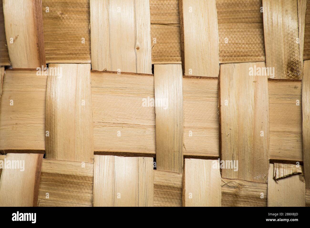 A natural basket surface texture of wide wooden slats in yellow tone, for rustic background Stock Photo