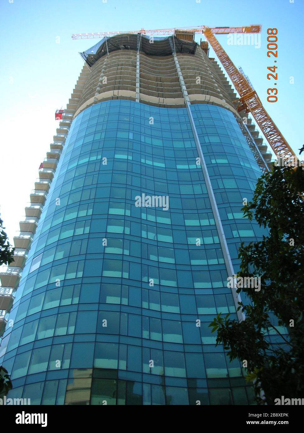 'English: Looking up at the Infinity (300 Spear Street) tower I under construction and the yellow tower crane.; 24 March 2008; Own work (Original text:  I created this work entirely by myself.); Cheers. Trance addict - Armin van Buuren - Oceanlab; ' Stock Photo