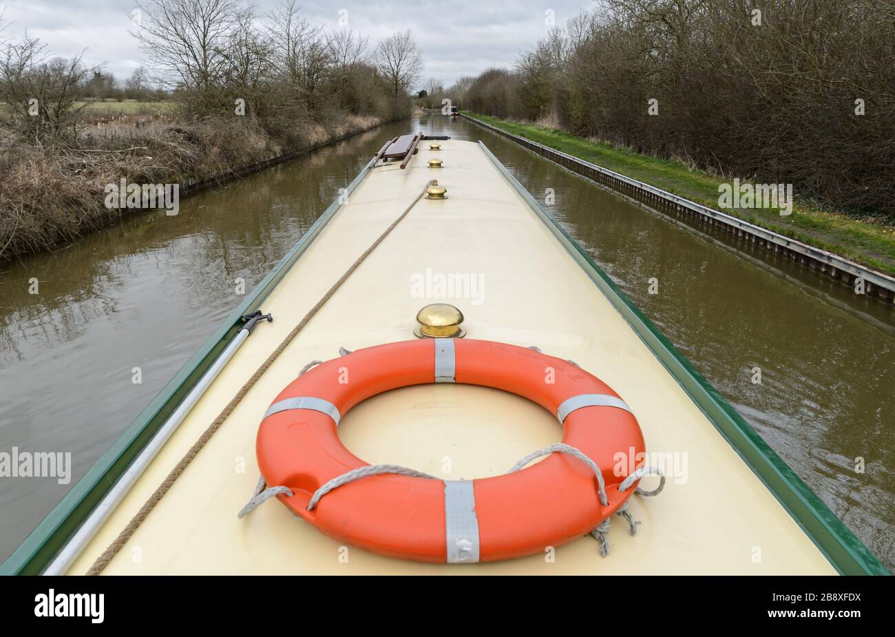 A narrowboat cruising peacefully along the Grand Union Canal near to Stockton in Warwickshire. Stock Photo