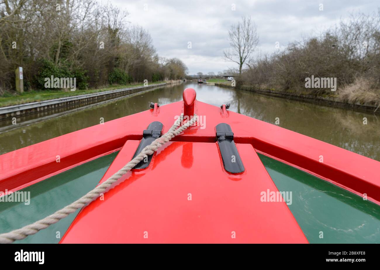 A narrowboat cruising peacefully along the Grand Union Canal near to Stockton in Warwickshire. Stock Photo