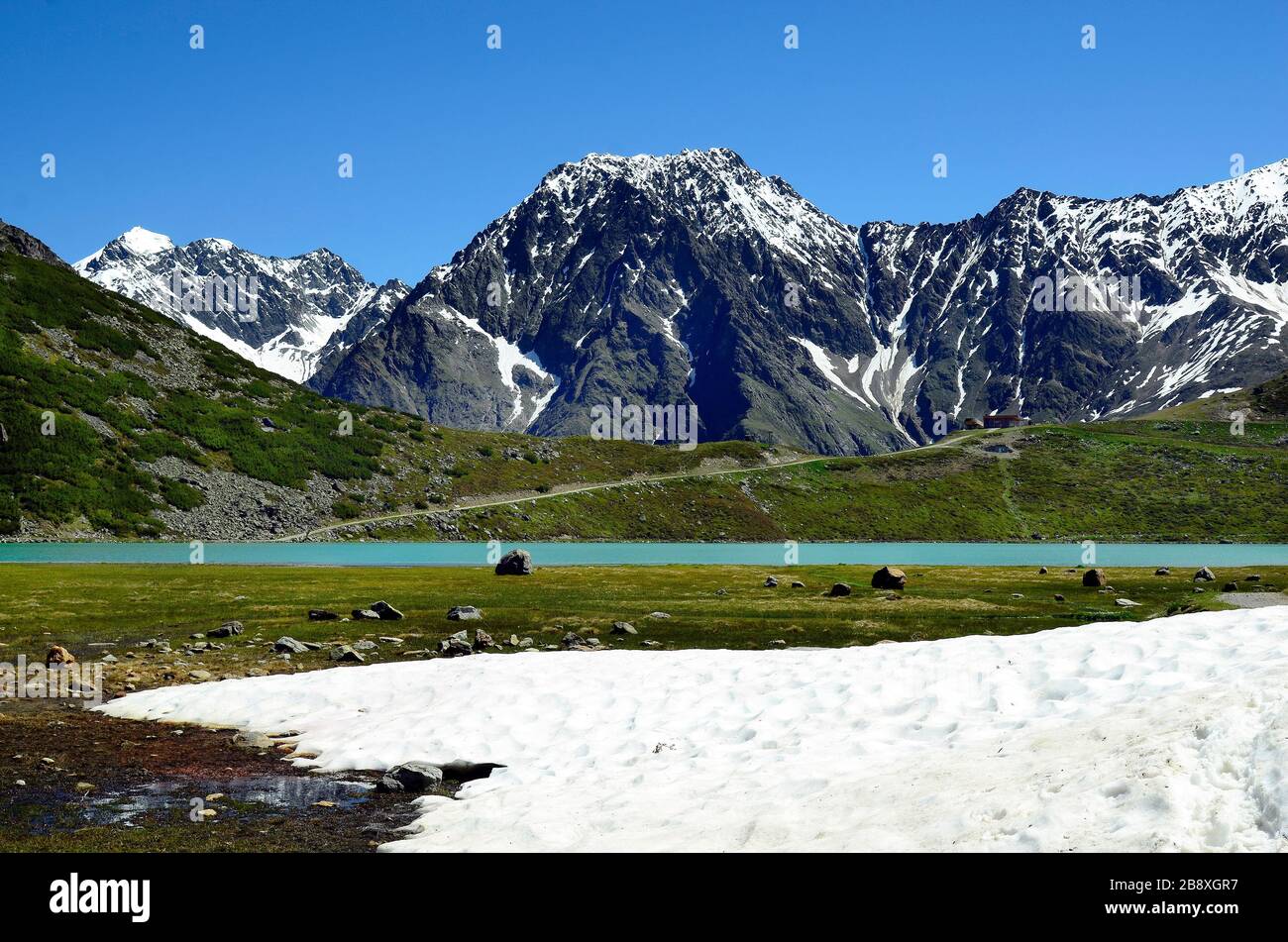 Austria, Tirol, Rifflsee - lake in Austrian Alps with mountain station of cable car Stock Photo