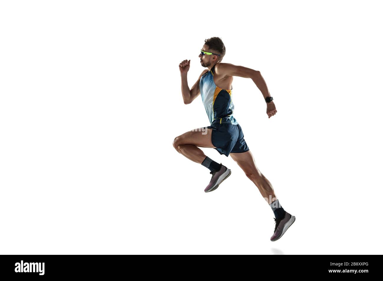 Triathlon male athlete running isolated on white studio background